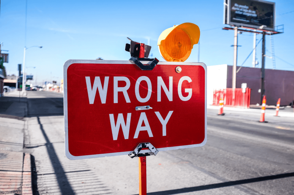 wrong way sign in street