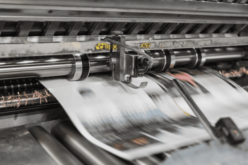 a printing press printing out a press release