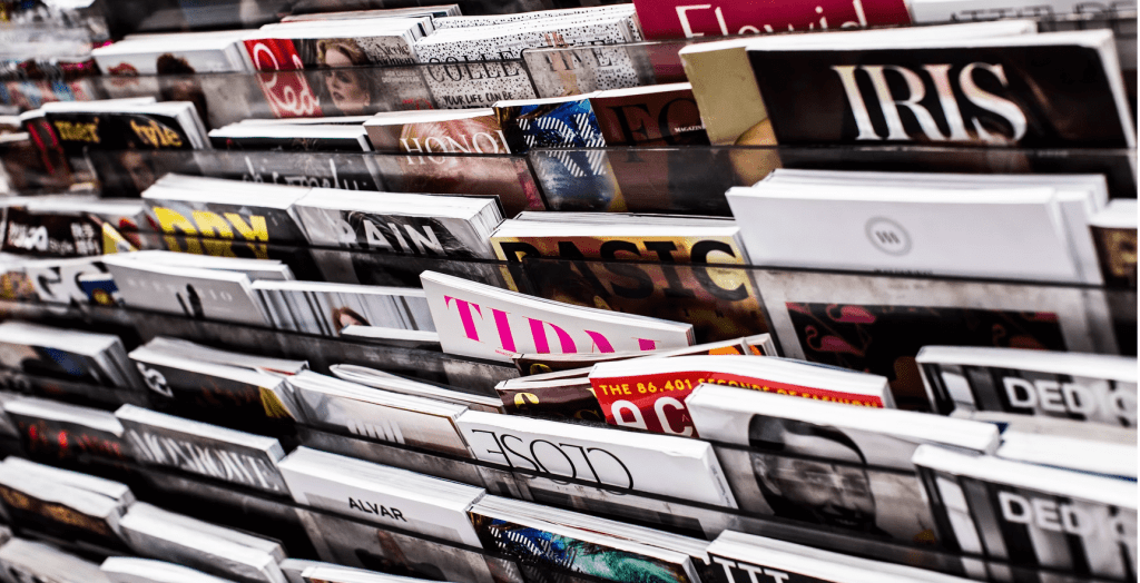 editorial design magazines stacked up in rack