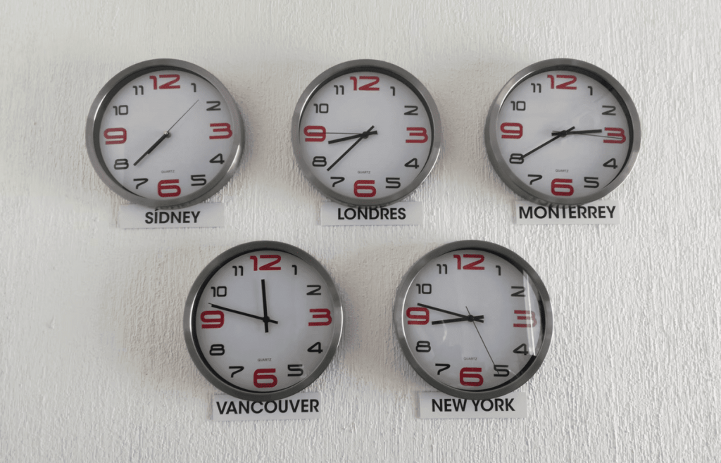 a series of clocks showing different time zones