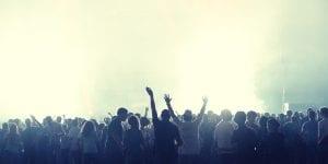 Image of a crowd cheering. This article will tell you everything you need to know about crowdfunding your startup.