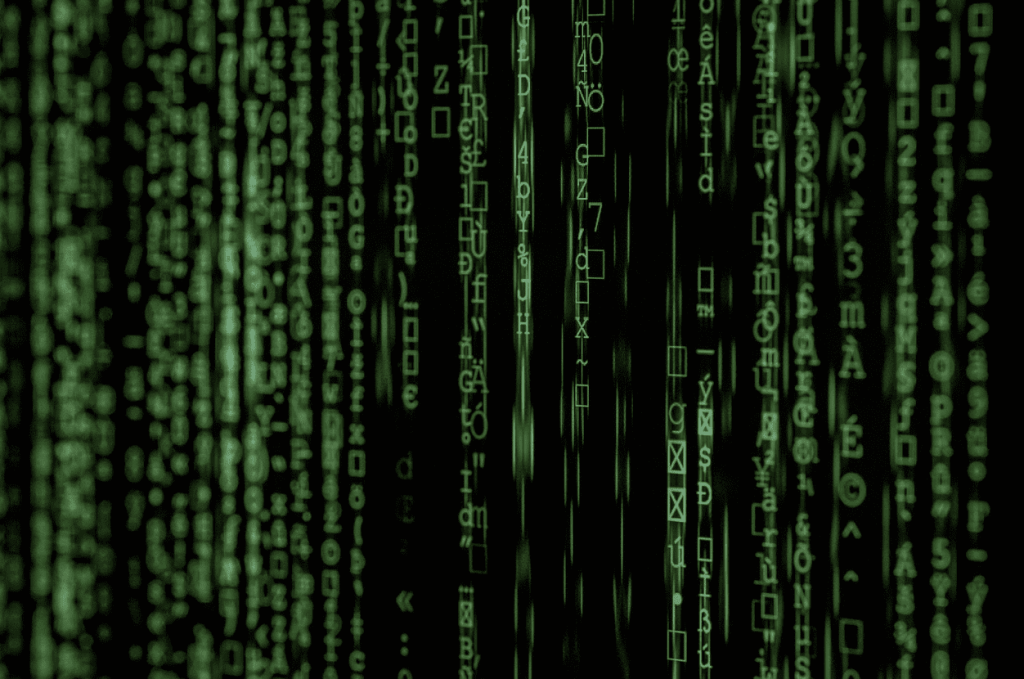 matrix movie still hacker binary code on computer screen