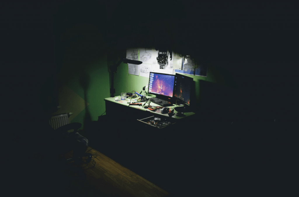 computer screen in dark corner