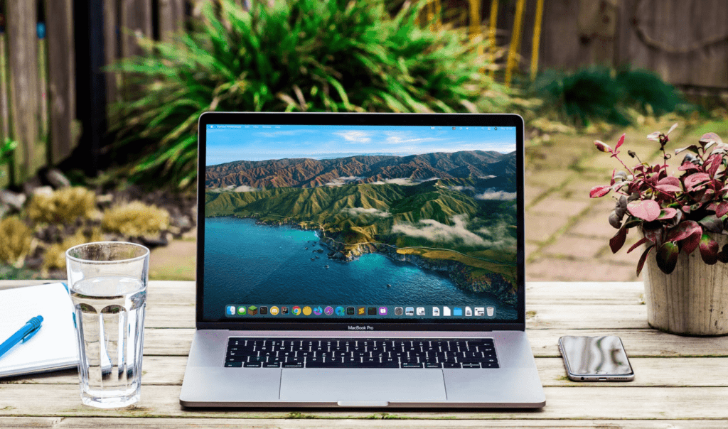 laptop on desk web hosting services